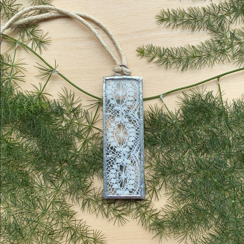 Glass and lace pendant